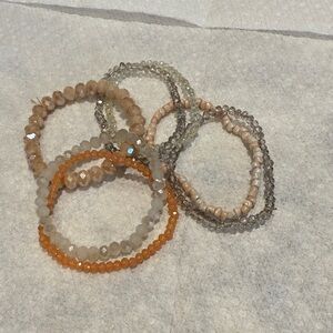 Elegant Beaded Bracelet Set - Orange, Beige, and Gray 7 piece set.
